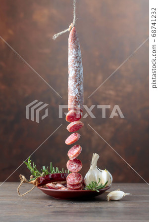 Dry-cured sausage with rosemary, garlic and 68741232
