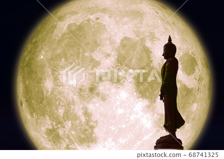 Sunday Buddha and full moon on night sky in the Sunday Buddha and full moon on night sky in the 68741325
