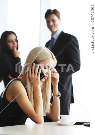 Businesswoman talking on phone 68742368
