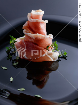 Prosciutto with thyme. 68742799