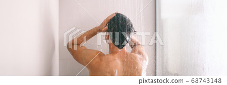 Shower man washing hair rinsing shampoo in bathroom banner panorama. Showering person at home lifestyle. Young guy taking a shower Shower man washing hair rinsing shampoo in bathroom banner panorama. Showering person at home lifestyle. Young guy taking a shower 68743148