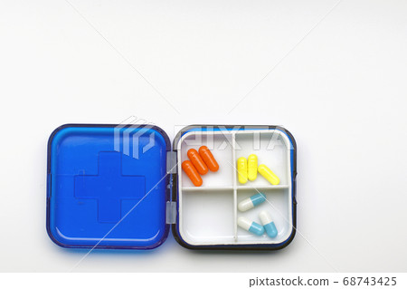 miscellaneous medicine in a health container 68743425