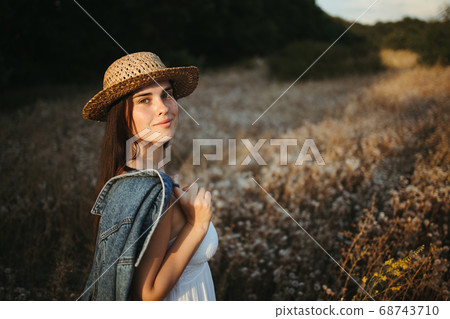 Happy carefree woman enjoy her vacation in nature 68743710