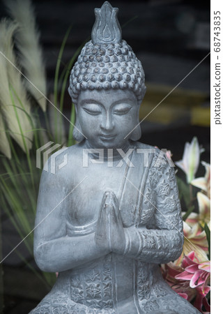 Closeup of stoned buddha statue Closeup of stoned buddha statue 68743835