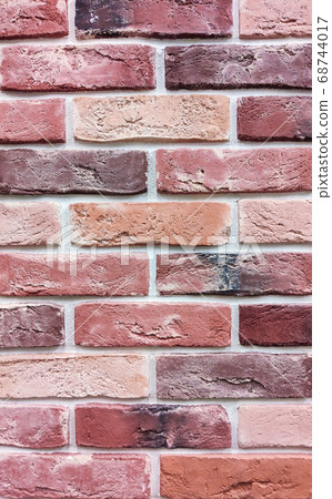 The background of the wall is a red brick surface. Abstract wall background 68744017