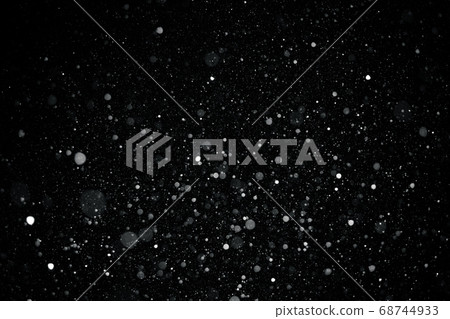 Falling snow on black background. 68744933