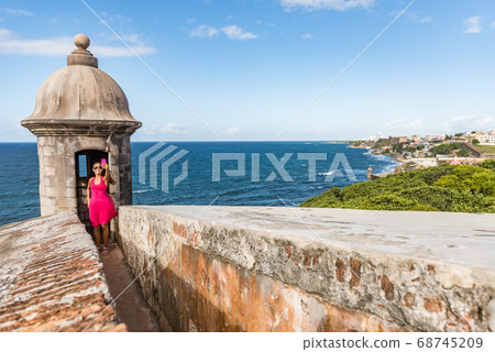 Puerto Rico San Juan city travel tourist taking phone selfie photo at Castillo San Felipe Del Morro fortress. Tourism in Old San Juan main attraction of the city famous cruise destination. Puerto Rico San Juan city travel tourist taking phone selfie photo at Castillo San Felipe Del Morro fortress. Tourism in Old San Juan main attraction of the city famous cruise destination. 68745209
