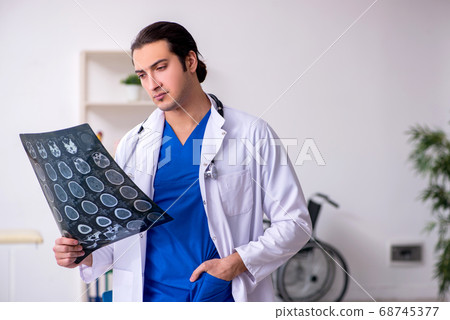 Young doctor working in the hospital 68745377