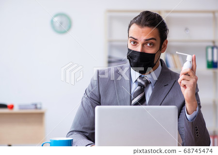 Young male employee in self-quarantine concept Young male employee in self-quarantine concept 68745474