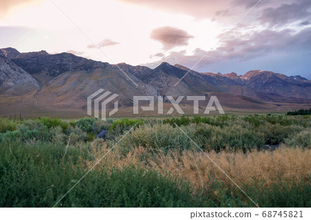 Mountain range with clouded colorful sunset, Eastern Sierra Nevada Mountains 68745821
