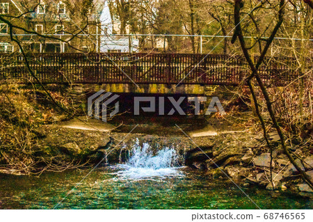 A Shot of a Waterfall Flowing Under a Bridge A Shot of a Waterfall Flowing Under a Bridge 68746565