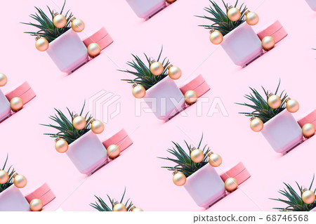 aloe concept with christmas balls on a pastel pink background, pattern 68746568