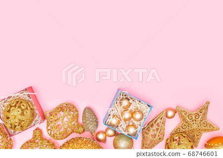 golden christmas decoration on pastel pink background, copyspace, layout 68746601