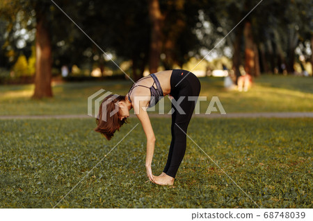 Plastic girl doing yoga. Health care. Plastic girl doing yoga. Health care. 68748039