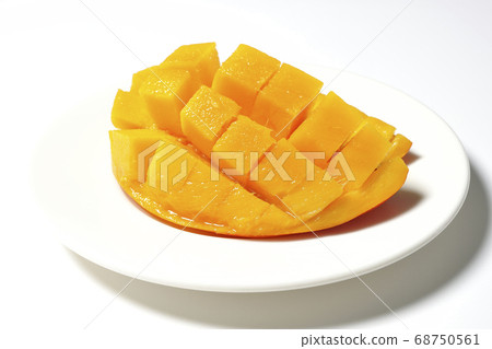 Mango of diced tropical fruits on a plate 68750561