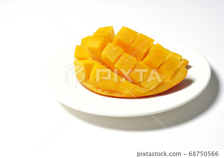 Mango of diced tropical fruits on a plate 68750566