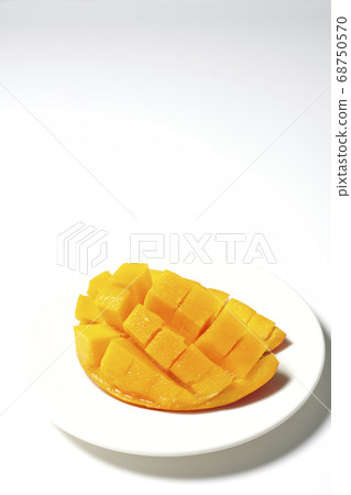 Mango of diced tropical fruits on a plate 68750570