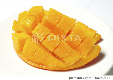 Mango of diced tropical fruits on a plate 68750572