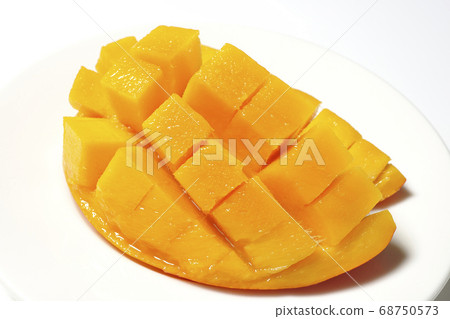 Mango of diced tropical fruits on a plate 68750573