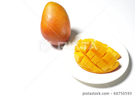 Mango of diced tropical fruits on a plate 68750593