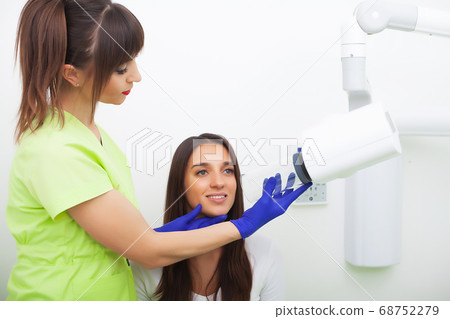 Close up portrait of attractive woman sitting in dentist office Close up portrait of attractive woman sitting in dentist office 68752279