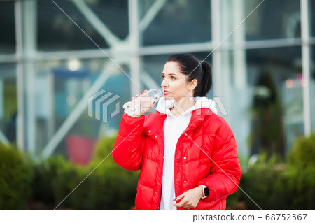 Sport outdoor. Woman Drinking Water After Running Sport outdoor. Woman Drinking Water After Running 68752367