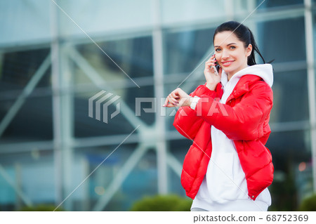 Fitness woman doing workout standing in a stadium background Fitness woman doing workout standing in a stadium background 68752369