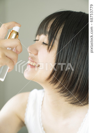 Women wearing make-up water 68753779