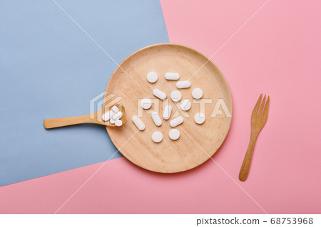 Assorted pharmaceutical medicine, Taking too much medication pills on spoon, Overdiagnosis drugs 68753968