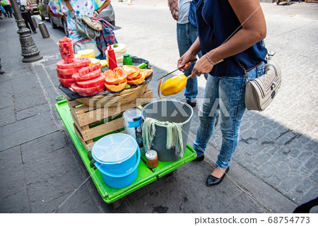 People selling fruits on the streets of Puebla, Mexico 68754773