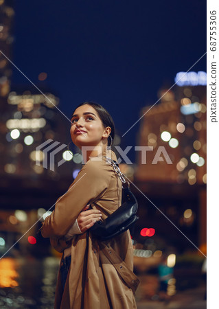 woman walking near Chicago river woman walking near Chicago river 68755306
