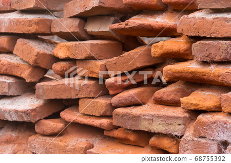 hole in an old brick wall collapsing 68755392
