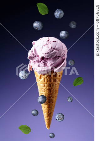 Blueberry ice cream in waffle cone. Blueberry ice cream in waffle cone. 68756819