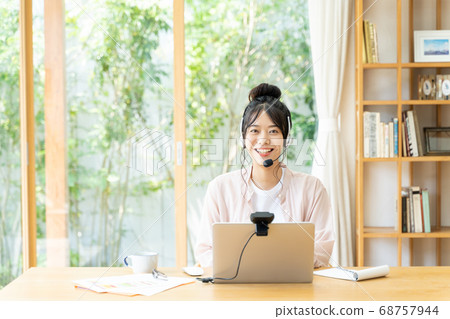 Young woman working remotely 68757944