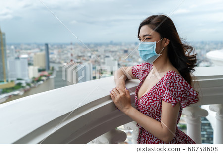 woman wearing medical mask for prevent to 68758608
