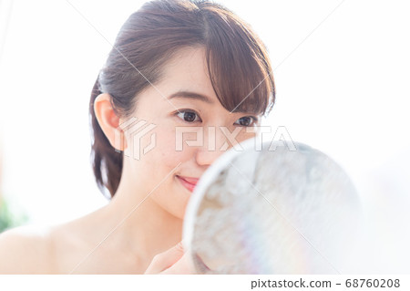 A woman applying a lip 68760208