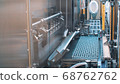 Pharmaceutical products. Medical vials standing on the production line of medical drugs against viruses 68762762