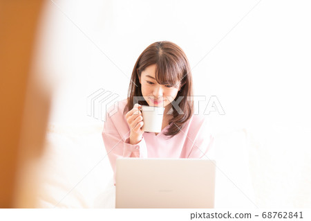 Teleworking woman Teleworking woman 68762841