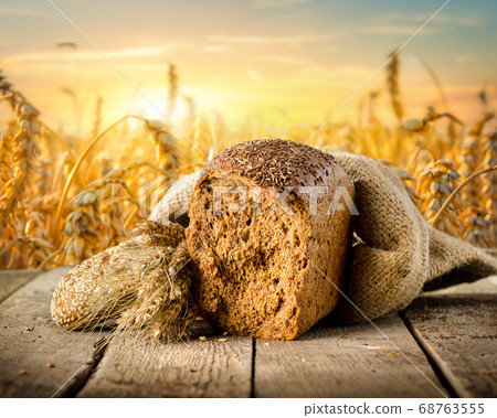 Bread and wheat field 68763555