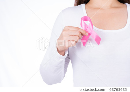 Breast cancer awareness ribbon on woman chest Breast cancer awareness ribbon on woman chest 68763683