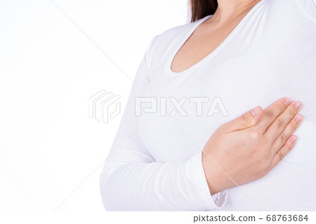 Woman hands doing breast self exam for checking Woman hands doing breast self exam for checking 68763684