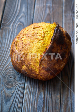 Homemade tartine bread on dark wooden table 68764066
