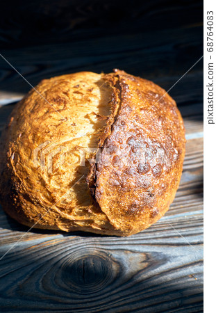 Homemade tartine bread on dark wooden table 68764083
