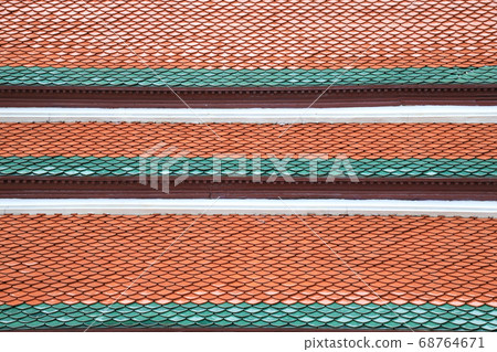 Pattern of Thai temple roof tiles on a sunny day. Pattern of Thai temple roof tiles on a sunny day. 68764671