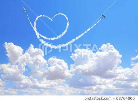 Two aircrafts draw a heart in the sky 68764800