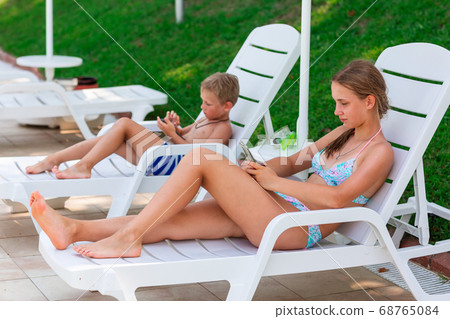Children playing games on the telephones. Gadget Children playing games on the telephones. Gadget 68765084