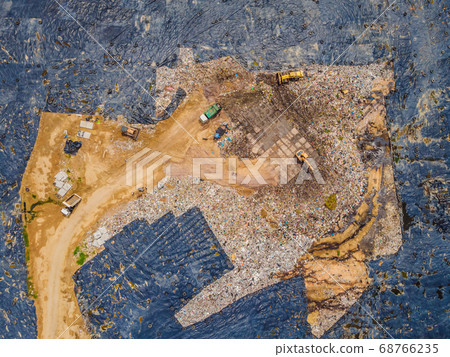 Aerial top view photo from flying drone of large garbage pile. Garbage pile in trash dump or landfill. Environmental pollution Aerial top view photo from flying drone of large garbage pile. Garbage pile in trash dump or landfill. Environmental pollution 68766235