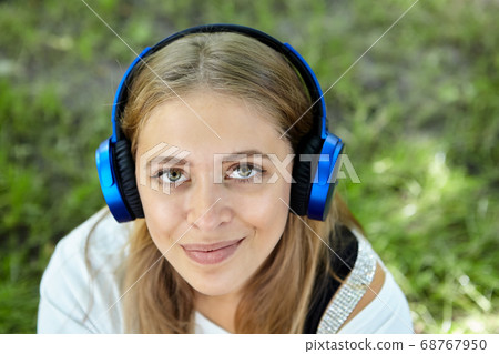 Pretty young white woman in public park. Pretty young white woman in public park. 68767950