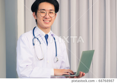 Portrait of doctor man wearing a doctor's dress 68768987