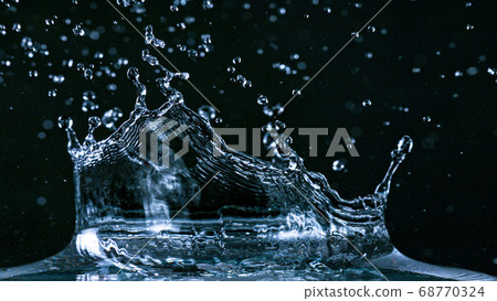 Water splash isolated on black background 68770324